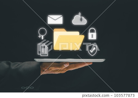 Document Management System (DMS), Business hand holding tablet with folder and document icon on virtual screen. .Software for archiving, searching and managing corporate files and information. Document Management System (DMS), Business hand holding tablet with folder and document icon on virtual screen. .Software for archiving, searching and managing corporate files and information. 103577873