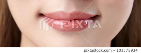Close up photo of asian woman's lips with natural make up 103578934