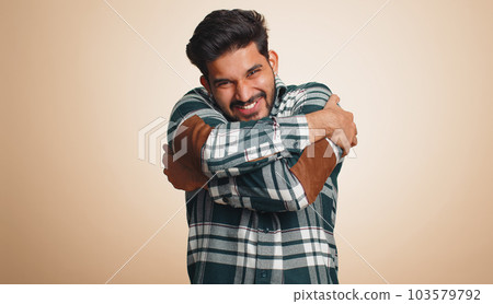 Indian bearded man spread hands and give hug embrace to you, pleasant expression love happy feelings Indian bearded man spread hands and give hug embrace to you, pleasant expression love happy feelings 103579792