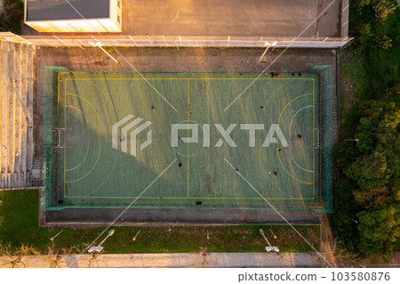Aerial view of green artificial football field. Aerial view of green artificial football field. 103580876