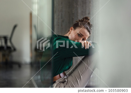 Young sad woman in office, having problem. Young sad woman in office, having problem. 103580903