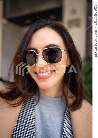 Portrait smiling middle age woman in sunglasses 103580909