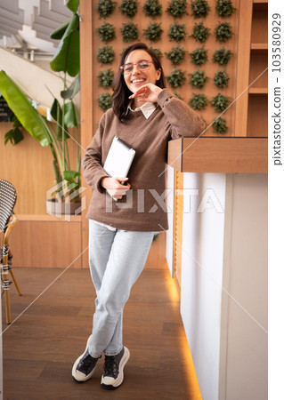 Woman in glasses with tablet computer Woman in glasses with tablet computer 103580929