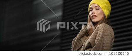 Portrait of young fashionable woman in a city. Portrait of young fashionable woman in a city. 103580940