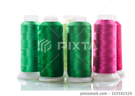 set of different color sewing threads,on white background. 103582329