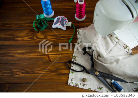 a set of tools and threads for sewing clothes a set of tools and threads for sewing clothes 103582340