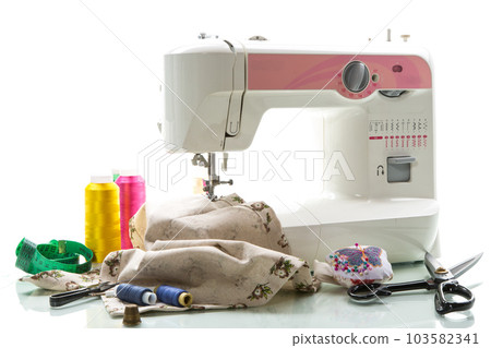 Sewing machine with fabric and threads for sewing, close-up. The working process Sewing machine with fabric and threads for sewing, close-up. The working process 103582341
