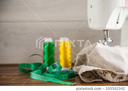 Sewing machine with fabric and threads for sewing, close-up. The working process 103582342