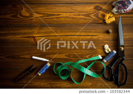 a set of tools and threads for sewing clothes 103582344