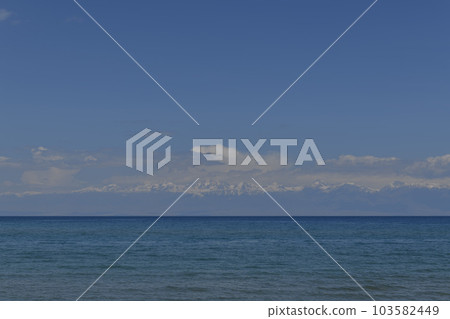 Issyk-Kul - lake in Kyrgyzstan. Summer mountain landscape. Kyrgyzstan mountains. Issyk-Kul - lake in Kyrgyzstan. Summer mountain landscape. Kyrgyzstan mountains. 103582449