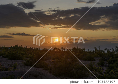 Issyk-Kul - lake in Kyrgyzstan. Summer mountain landscape. Kyrgyzstan mountains. Sunset. 103582497