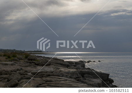 Issyk-Kul - lake in Kyrgyzstan. Summer mountain landscape. Kyrgyzstan mountains. 103582511