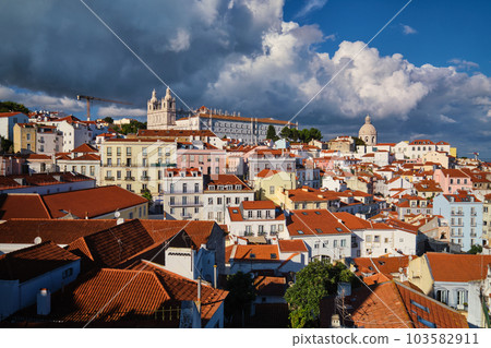 View of Lisbon famous postcard iconic view from Miradouro de Santa Luzia tourist viewpoint over Alfama old city district. Lisbon, Portugal. 103582911