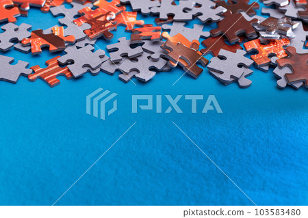 Colorful Jigsaw Puzzle on Blue Background Colorful Jigsaw Puzzle on Blue Background 103583480