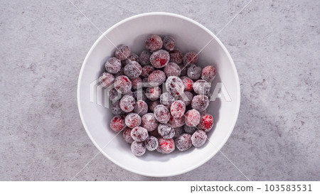 Flat lay. Step by step. Prepating sugar cranberries with organic cranberries and white sugar. Flat lay. Step by step. Prepating sugar cranberries with organic cranberries and white sugar. 103583531