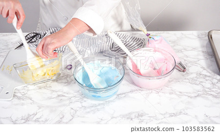 Step by step. Mixing food coloring into the meringue to bake unicorn meringue cookies. Step by step. Mixing food coloring into the meringue to bake unicorn meringue cookies. 103583562