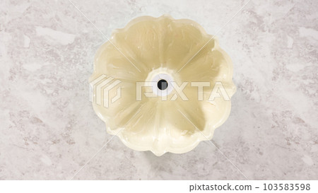 Flat lay. Step by step. Greasing bundt cake pan with vegetable shortening and flour to bake funfettti bundt cake. 103583598