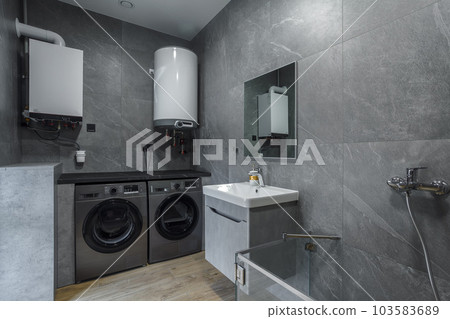 Modern furnished bathroom dark grey interior design with granite tiles Modern furnished bathroom dark grey interior design with granite tiles 103583689