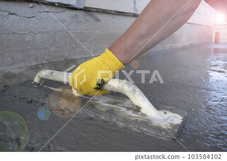 Mason leveling and screeding concrete floor base 103584102