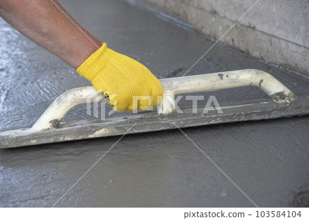 Mason leveling and screeding concrete floor base 103584104