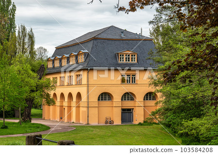 The Reithaus in the park along the Ilm River in Weimar, Thuringia, Germany. A former part of City Castle The Reithaus in the park along the Ilm River in Weimar, Thuringia, Germany. A former part of City Castle 103584208