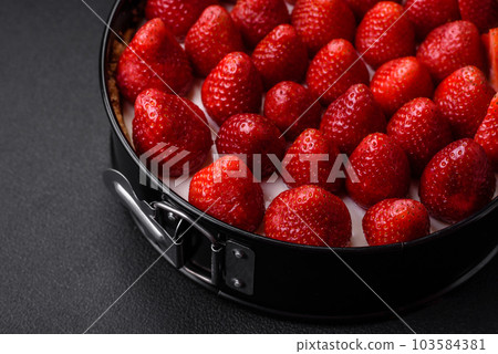 Delicious sweet cake or cheesecake with mascarpone cheese and strawberries Delicious sweet cake or cheesecake with mascarpone cheese and strawberries 103584381