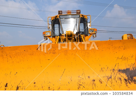 Snowplow waiting in a snowy country 103584834