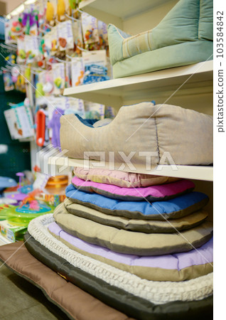 Sleeping place for pet assortment on vet shop store shelves 103584842