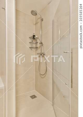 a bathroom with a shower stall and stand up shower head rester in the corner of the walk - in shower a bathroom with a shower stall and stand up shower head rester in the corner of the walk - in shower 103585164