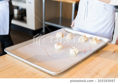 Kids learning how to cook at the Birthday party. 103585697
