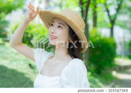 Woman with long hair outdoors Woman with long hair outdoors 103587369