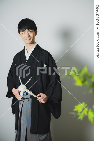 A man in a hakama with a crest A man in a hakama with a crest 103587403