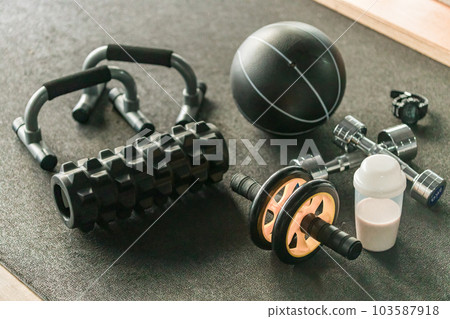 Gym muscle training goods (dumbbells, foam rollers, protein) Gym muscle training goods (dumbbells, foam rollers, protein) 103587918