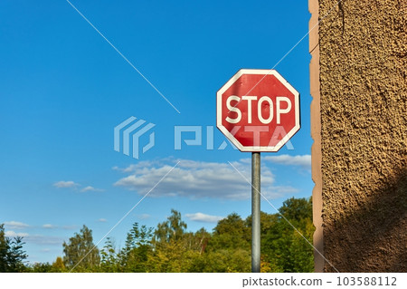 Stop sign on a corner Stop sign on a corner 103588112