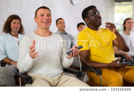 Group of positive men listening to a lecture 103588499