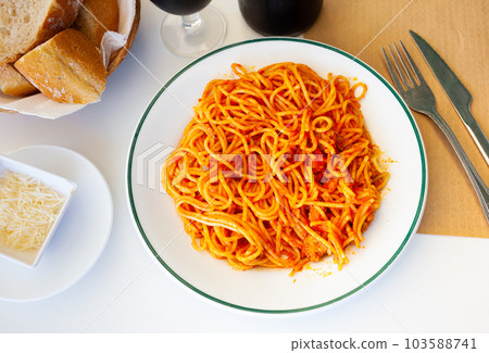 Italian bolonesa, bolognese noodles with tomato sauce and cheese in cafe Italian bolonesa, bolognese noodles with tomato sauce and cheese in cafe 103588741