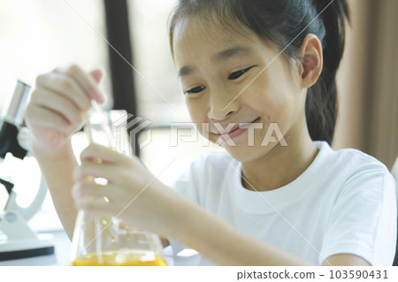 Little child with learning science class in school laboratory Little child with learning science class in school laboratory 103590431