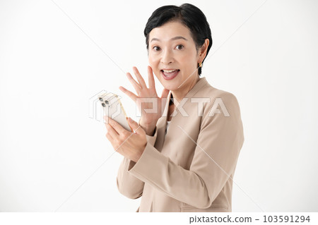 A woman watching smartphone 103591294