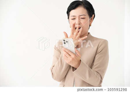A woman watching smartphone 103591298