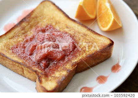Toast arrangement with homemade strawberry sauce Toast arrangement with homemade strawberry sauce 103592420
