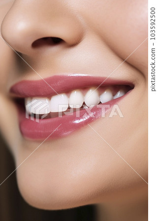 Close-up of a smiling woman's mouth "AI-generated image" Close-up of a smiling woman's mouth "AI-generated image" 103592500