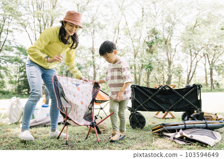 Family/family image preparing for camping 103594649