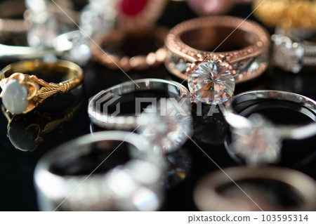 Beautiful diamond rings jewelry background Beautiful diamond rings jewelry background 103595314