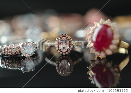 big red ruby ring with jewelry background big red ruby ring with jewelry background 103595315