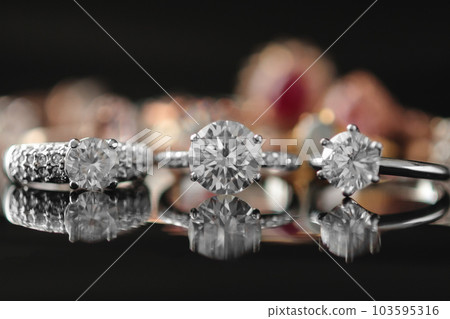 Beautiful diamond rings jewelry background Beautiful diamond rings jewelry background 103595316