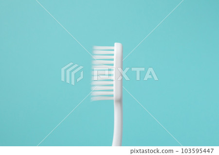 Toothbrush on blue background top view close up 103595447