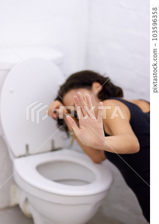 Bathroom, hand and sick woman on floor suffering from anorexia, depression or anxiety. Stress, toilet and female with body dysmorphia, bulimia or an eating disorder, nausea and mental health problem 103596358
