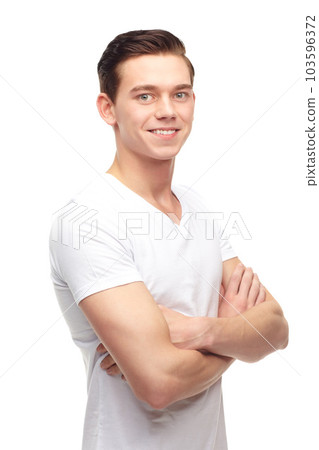 Fashion, arms crossed and smile with portrait of man in studio for confident, positive and casual. Trendy, happy and face with male model isolated on white background for happiness, natural and cool 103596372