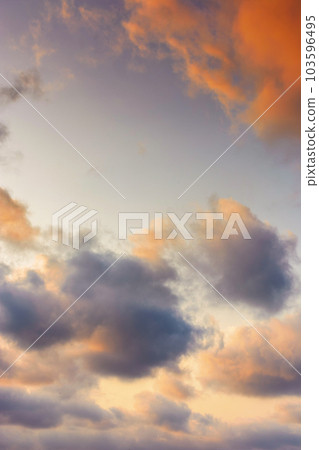 evening sky in orange glow. huge fluffy clouds. dramatic natural background 103596495