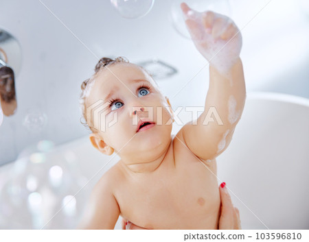 I dont mean to burst your bubble but Im the cutest. Shot of an adorable baby boy taking a bath at home. I dont mean to burst your bubble but Im the cutest. Shot of an adorable baby boy taking a bath at home. 103596810